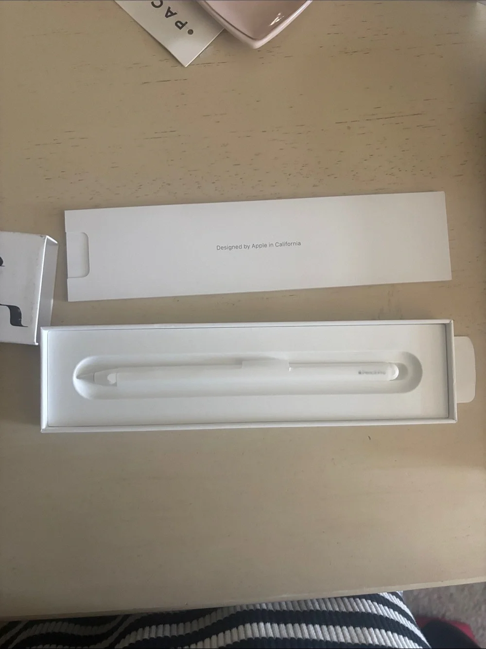 Apple Pencil with Black Graphic Sleeve on White Box
